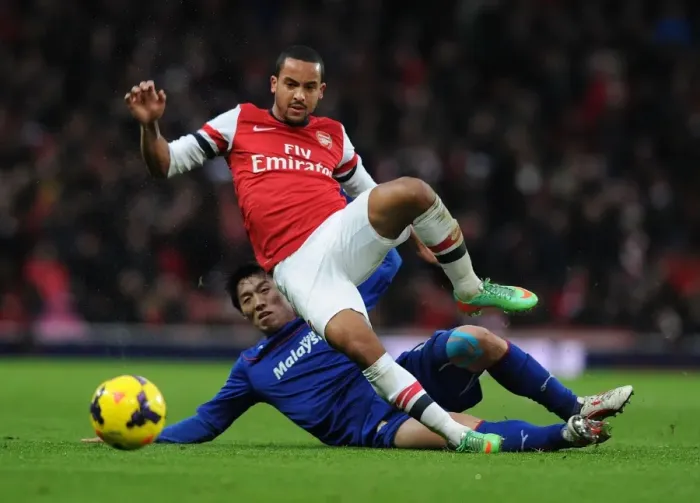 Framed Print : Theo Walcott vs Bo-Kyung Kim: A Premier League Showdown at Arsenal Framed Print : Theo Walcott vs Bo-Kyung Kim: A Premier League Showdown at Arsenal