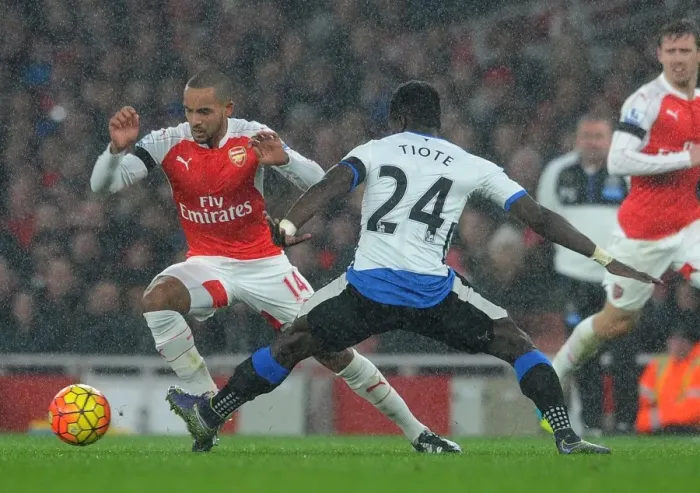 Framed Print : Theo Walcott vs. Cheick Tiote: A Fierce Battle in the Arsenal v Newcastle United Premier League Clash Framed Print : Theo Walcott vs. Cheick Tiote: A Fierce Battle in the Arsenal v Newcastle United Premier League Clash