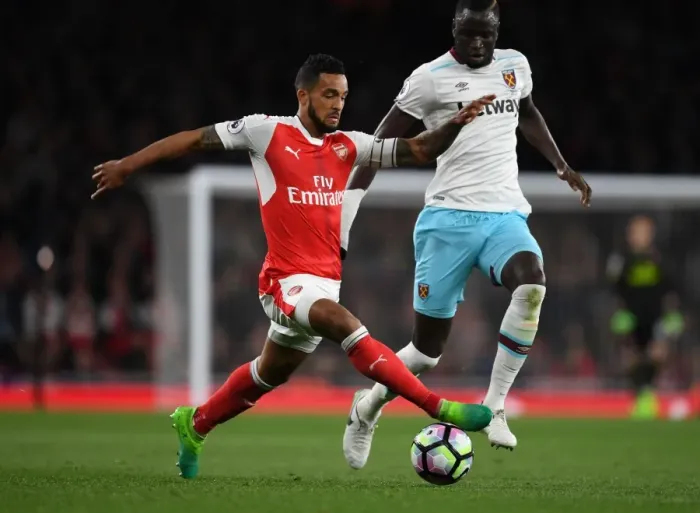 Framed Print : Theo Walcott vs. Cheikhou Kouyate: A Battle at the Emirates - Arsenal v West Ham United, Premier League
