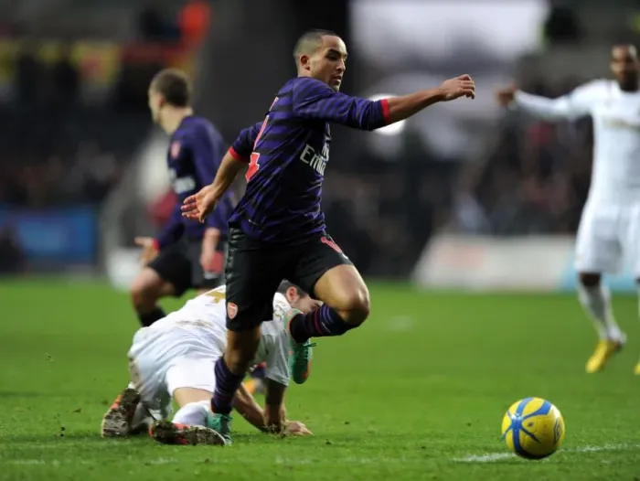 Framed Print : Theo Walcott vs Chico Flores: A FA Cup Battle at Swansea Framed Print : Theo Walcott vs Chico Flores: A FA Cup Battle at Swansea