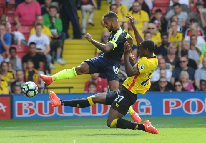 Framed Print : Theo Walcott vs Christian Kabasele: A Premier League Face-Off at Vicarage Road Framed Print : Theo Walcott vs Christian Kabasele: A Premier League Face-Off at Vicarage Road