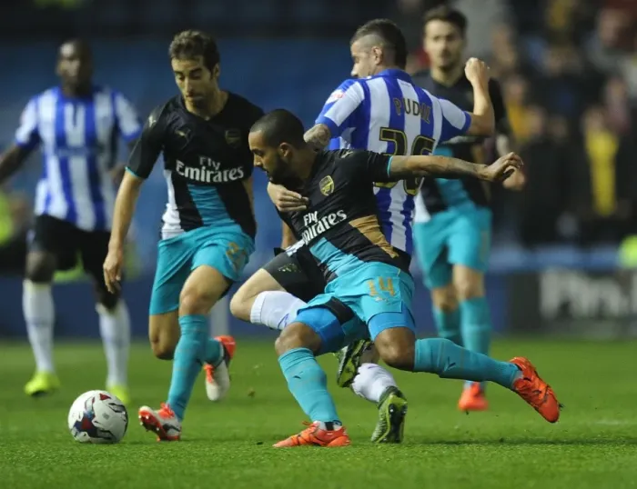 Framed Print : Theo Walcott vs Daniel Pudil: A Fight for Supremacy in the Capital One Cup