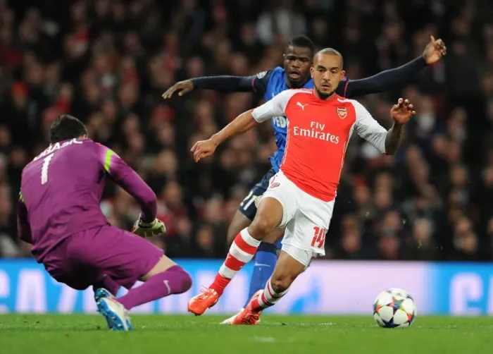 Framed Print : Theo Walcott vs. Danijel Subasic: Intense Battle in Arsenal v Monaco UEFA Champions League Clash Framed Print : Theo Walcott vs. Danijel Subasic: Intense Battle in Arsenal v Monaco UEFA Champions League Clash