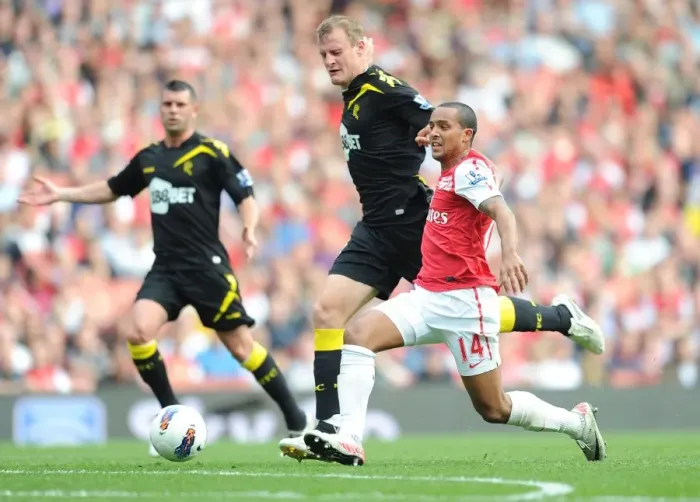 Framed Print : Theo Walcott vs. David Wheater: Red Card Drama at Arsenal vs. Bolton Wanderers (2011-12)