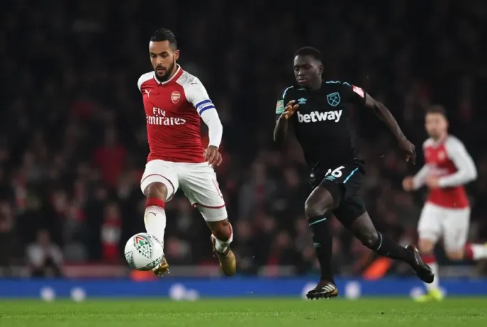Framed Print : Theo Walcott vs. Domingos Quina: A Carabao Cup Battle at Emirates Stadium Framed Print : Theo Walcott vs. Domingos Quina: A Carabao Cup Battle at Emirates Stadium