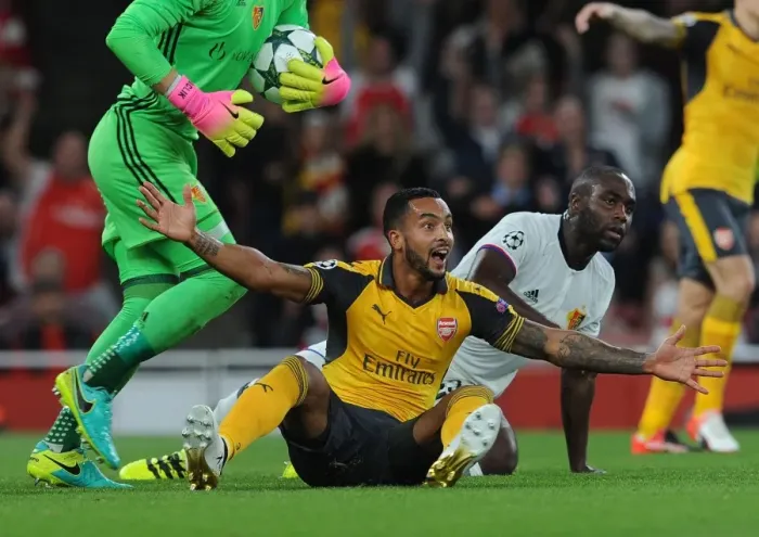 Framed Print : Theo Walcott vs. Eder Balanta: A Controversial Penalty Call in Arsenal's UEFA Champions League Clash with FC Basel Framed Print : Theo Walcott vs. Eder Balanta: A Controversial Penalty Call in Arsenal's UEFA Champions League Clash with FC Basel