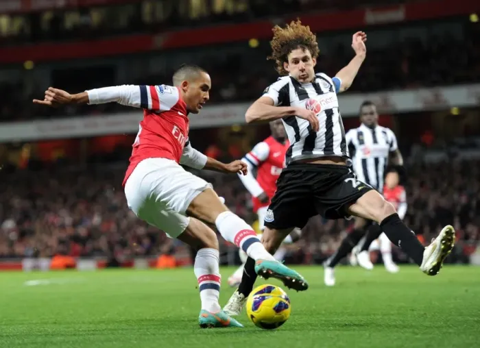 Framed Print : Theo Walcott vs Fabricio Coloccini: Battle at Emirates Stadium (Arsenal v Newcastle United, 2012-13) Framed Print : Theo Walcott vs Fabricio Coloccini: Battle at Emirates Stadium (Arsenal v Newcastle United, 2012-13)