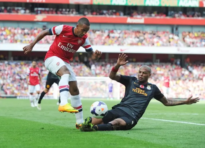 Framed Print : Theo Walcott vs. Felipe Melo: Galatasaray's Upset Over Arsenal in Emirates Cup Day Two Framed Print : Theo Walcott vs. Felipe Melo: Galatasaray's Upset Over Arsenal in Emirates Cup Day Two