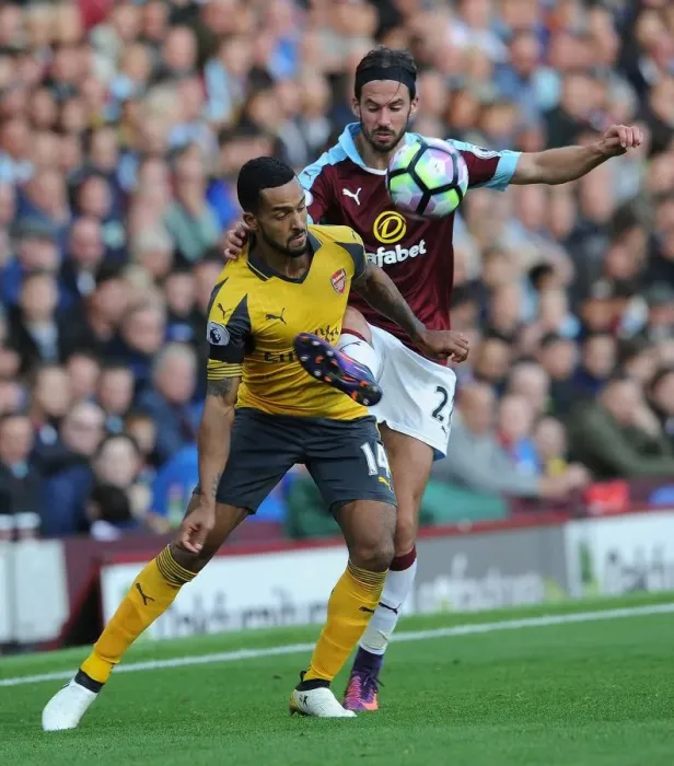 Framed Print : Theo Walcott vs George Boyd: A Premier League Showdown at Burnley's Turf Moor (2016-17) Framed Print : Theo Walcott vs George Boyd: A Premier League Showdown at Burnley's Turf Moor (2016-17)