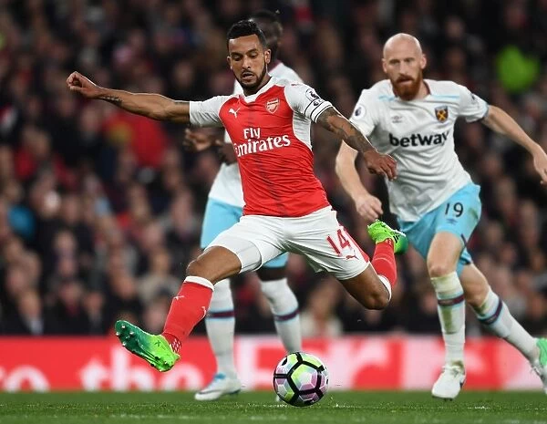 Theo Walcott vs. James Collins: A Premier League Face-Off at Arsenal