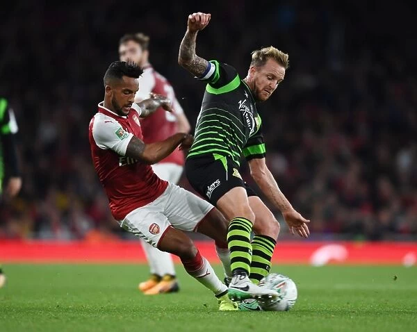Theo Walcott vs. James Coppinger: Arsenal vs. Doncaster Rovers in Carabao Cup Clash