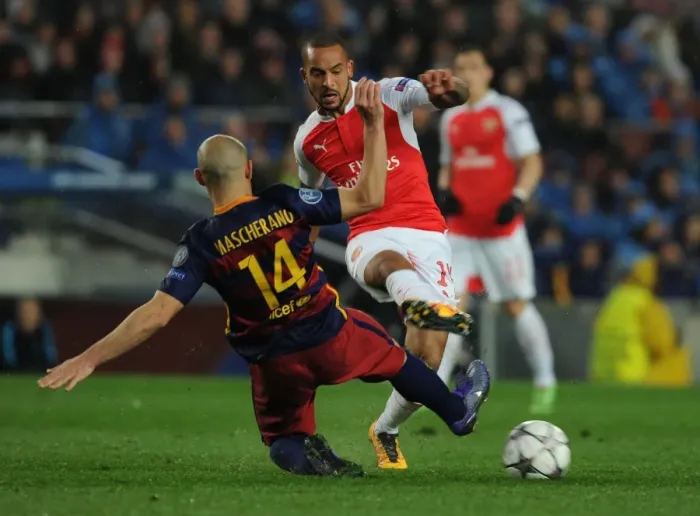 Framed Print : Theo Walcott vs Javier Mascherano: A Battle of Wits in the Barcelona vs Arsenal UEFA Champions League Clash Framed Print : Theo Walcott vs Javier Mascherano: A Battle of Wits in the Barcelona vs Arsenal UEFA Champions League Clash
