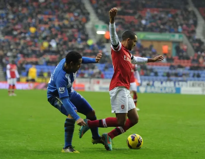 Framed Print : Theo Walcott vs. Jean Beausejour: Penalty Drama at Wigan Athletic vs. Arsenal (2012-13) Framed Print : Theo Walcott vs. Jean Beausejour: Penalty Drama at Wigan Athletic vs. Arsenal (2012-13)