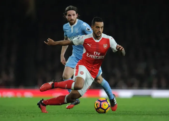 Framed Print : Theo Walcott vs Joe Allen: Intense Battle at Arsenal's Emirates Stadium (Arsenal v Stoke City, 2016-17)