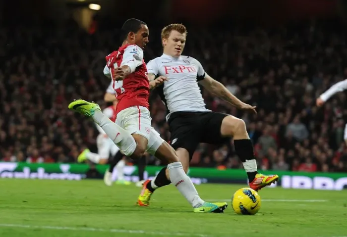 Framed Print : Theo Walcott vs. John Arne Riisse: A Battle at Emirates Stadium (Arsenal v Fulham, 2011-12) Framed Print : Theo Walcott vs. John Arne Riisse: A Battle at Emirates Stadium (Arsenal v Fulham, 2011-12)