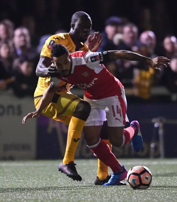 Framed Print : Theo Walcott vs. Kevin Amankwaah: A FA Cup Battle at Sutton United (2017) Framed Print : Theo Walcott vs. Kevin Amankwaah: A FA Cup Battle at Sutton United (2017)