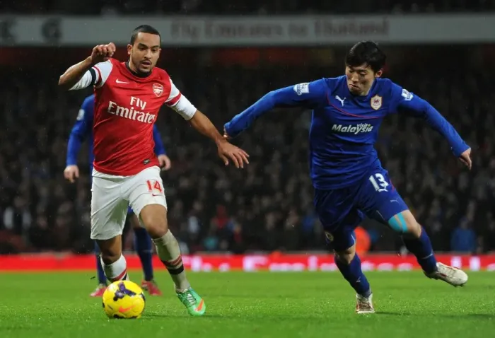 Framed Print : Theo Walcott vs. Kim Bo-Kyung: A Battle at the Emirates - Arsenal v Cardiff City, Premier League Framed Print : Theo Walcott vs. Kim Bo-Kyung: A Battle at the Emirates - Arsenal v Cardiff City, Premier League