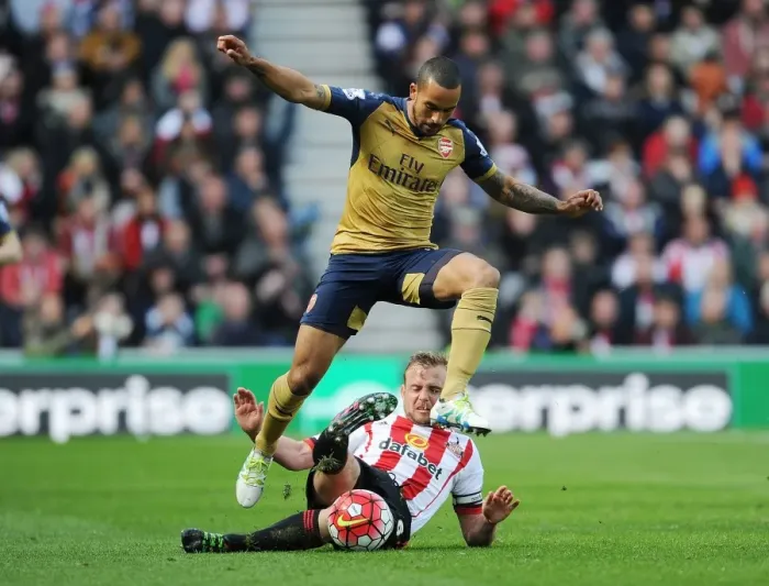 Framed Print : Theo Walcott vs. Lee Cattermole: A Premier League Battle at Sunderland's Stadium of Light (April 2016)
