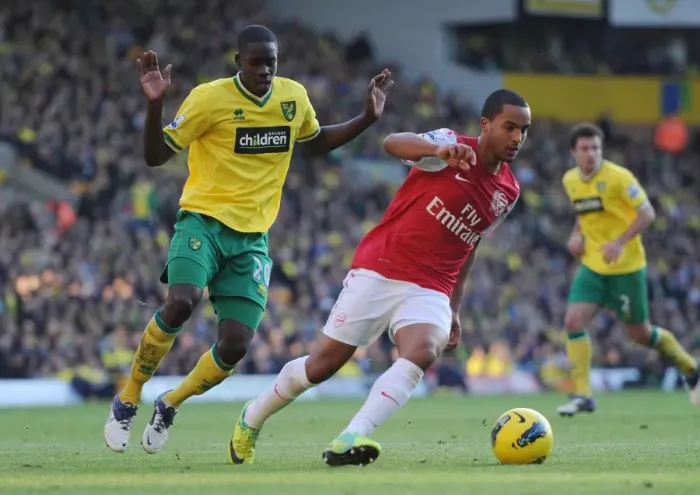 Framed Print : Theo Walcott vs. Leon Barnett: A Premier League Battle at Carrow Road, November 2011