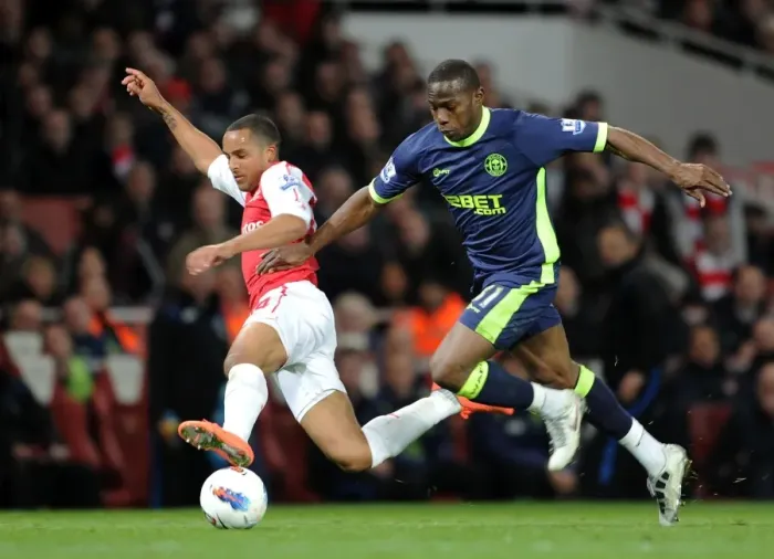 Framed Print : Theo Walcott vs. Maynor Figueroa: A Fierce Rivalry Unfolds at Emirates Stadium (Arsenal vs. Wigan Athletic, 2012)