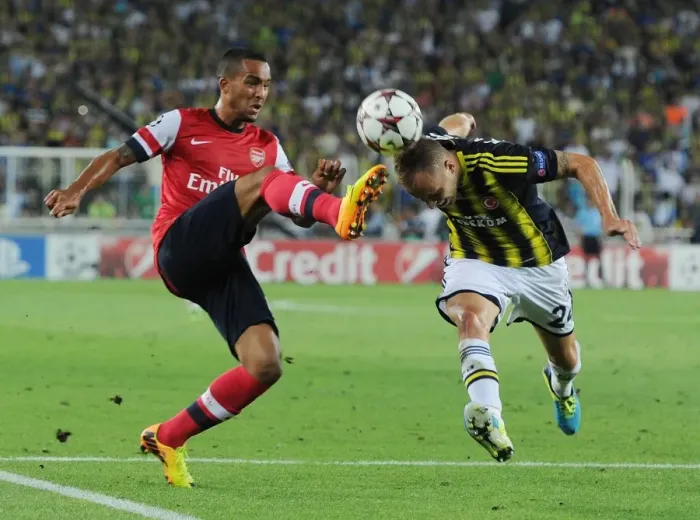 Framed Print : Theo Walcott vs. Michal Kadlec: A Clash in the UEFA Champions League Play-offs between Fenerbahce and Arsenal