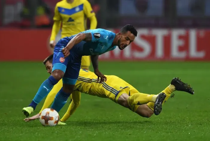 Framed Print : Theo Walcott vs. Mirko Ivanic: A Battle in the Europa League between Arsenal and BATE Borisov