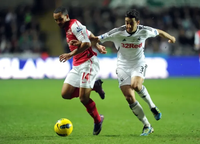 Framed Print : Theo Walcott vs. Neil Taylor: A Football Rivalry Erupts at Swansea City (2011-12)