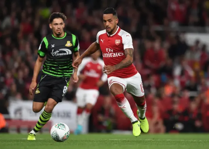 Framed Print : Theo Walcott vs Niall Mason: Arsenal vs Doncaster Rovers in Carabao Cup Clash Framed Print : Theo Walcott vs Niall Mason: Arsenal vs Doncaster Rovers in Carabao Cup Clash