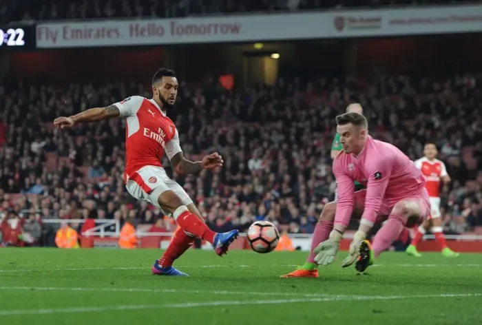 Framed Print : Theo Walcott vs. Paul Farman: A Battle in the Emirates FA Cup Quarter-Finals