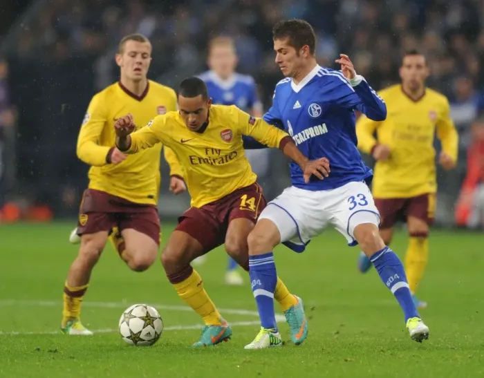 Framed Print : Theo Walcott vs. Roman Neustadter: A Battle in the UEFA Champions League between Schalke 04 and Arsenal FC Framed Print : Theo Walcott vs. Roman Neustadter: A Battle in the UEFA Champions League between Schalke 04 and Arsenal FC