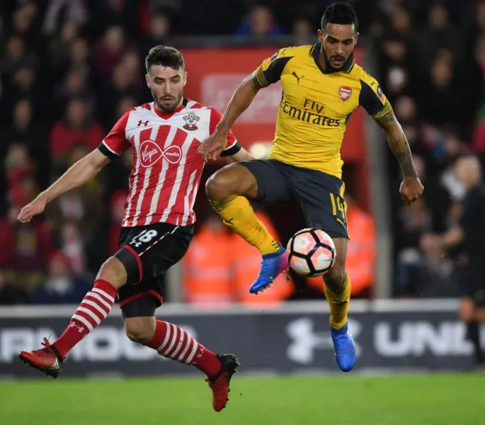 Framed Print : Theo Walcott vs Sam McQueen: A Battle in the FA Cup Fourth Round - Southampton vs Arsenal