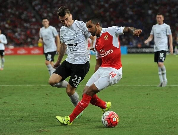 Theo Walcott vs. Seamus Coleman: A Clash of Football Giants in the Barclays Asia Trophy