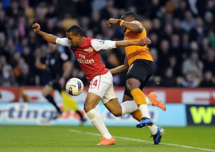 Framed Print : Theo Walcott vs. Sebastien Bassong: A Penalty Showdown Deciding Arsenal's Victory (2011-12) Framed Print : Theo Walcott vs. Sebastien Bassong: A Penalty Showdown Deciding Arsenal's Victory (2011-12)