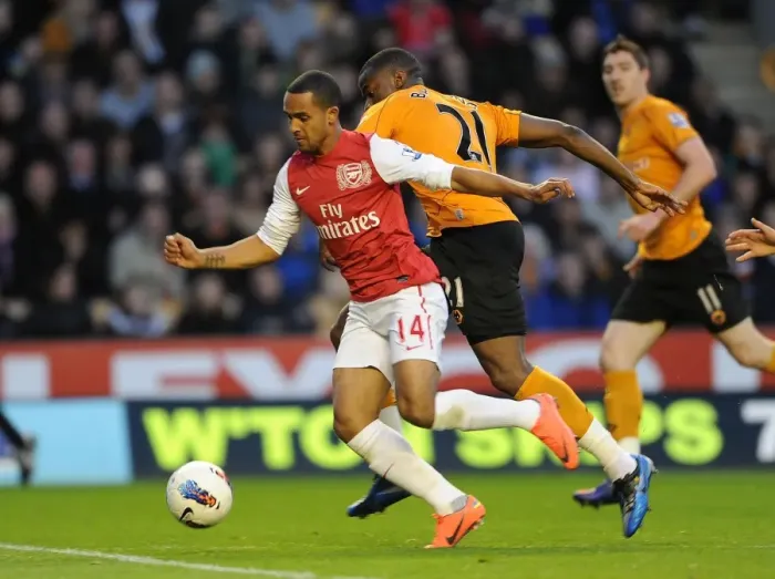 Framed Print : Theo Walcott vs Sebastien Bassong: A Penalty Showdown at Molineux (2011-12) Framed Print : Theo Walcott vs Sebastien Bassong: A Penalty Showdown at Molineux (2011-12)