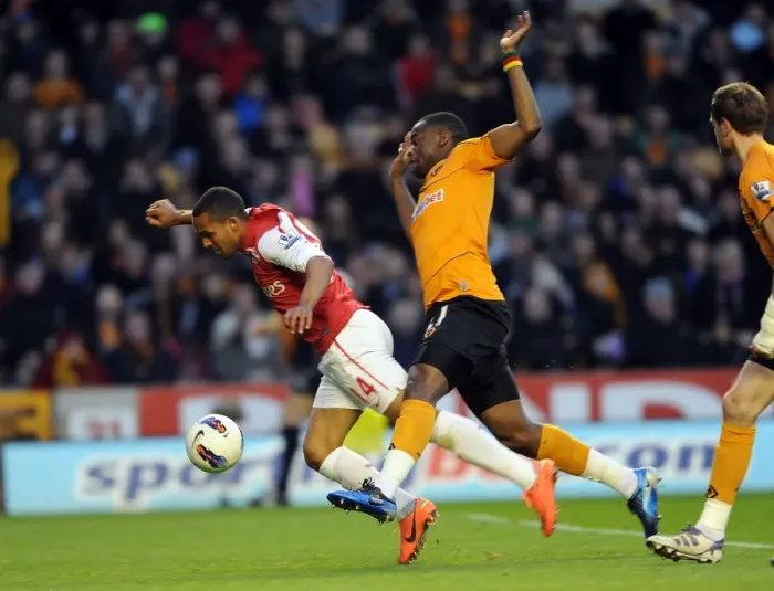 Framed Print : Theo Walcott vs Sebastien Bassong: A Penalty Showdown at Molineux (2011-12) Framed Print : Theo Walcott vs Sebastien Bassong: A Penalty Showdown at Molineux (2011-12)