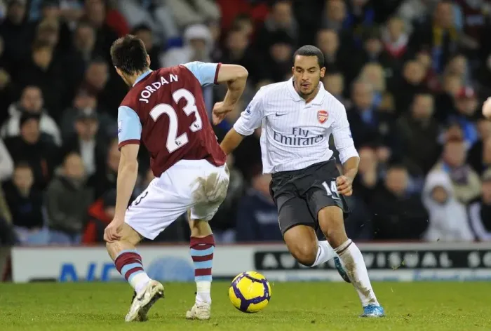 Framed Print : Theo Walcott vs. Stephen Jordan: A Draw at Burnley's Turf Moor in the Barclays Premier League (2009-10)