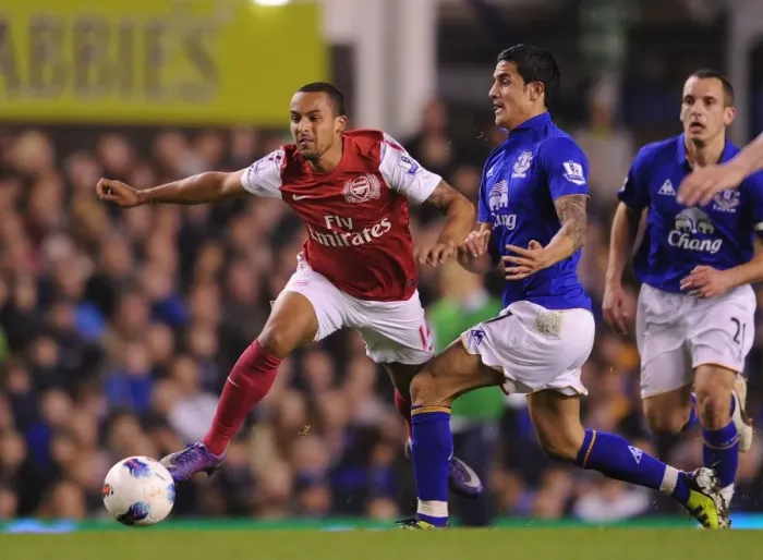 Framed Print : Theo Walcott vs. Tim Cahill: Battle at Goodison Park - Everton vs. Arsenal, Premier League 2011-12