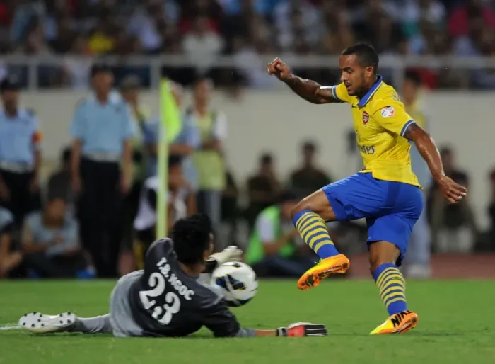Framed Print : Theo Walcott vs Tran Buu Ngoc: Vietnam Stands Strong Against Arsenal