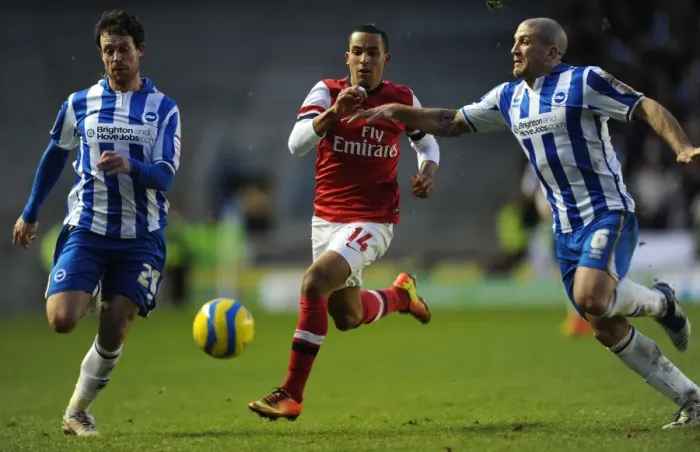 Framed Print : Theo Walcott vs. Wayne Bridge and Adam El-Abd: Intense Battle in FA Cup Match between Brighton & Hove Albion and Arsenal Framed Print : Theo Walcott vs. Wayne Bridge and Adam El-Abd: Intense Battle in FA Cup Match between Brighton & Hove Albion and Arsenal