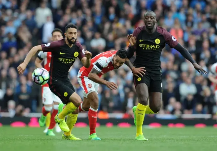 Framed Print : Theo Walcott vs Yaya Toure and Gael Clichy: Intense Battle at Arsenal vs Manchester City, Premier League 2016-17