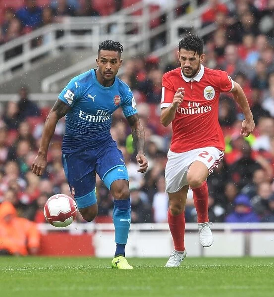 Theo Walcott's Agile Moves: Outmaneuvering Pizzi in Arsenal's Emirates Cup Victory