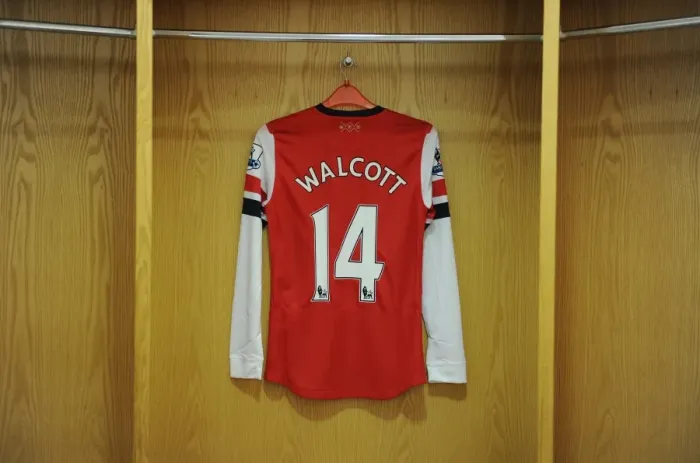 Framed Print : Theo Walcott's Arsenal Jersey at Emirates Stadium: Arsenal vs Aston Villa (2012-13)