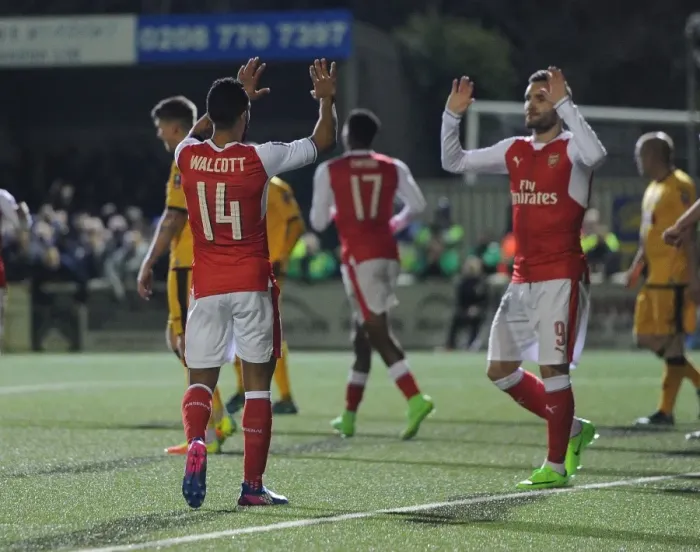 Framed Print : Theo Walcott's Brace: Arsenal's Emirates FA Cup Victory over Sutton United
