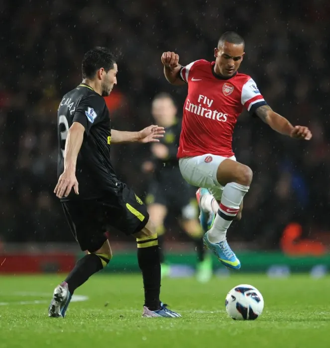 Framed Print : Theo Walcott's Brilliant Performance: Arsenal Crushes Wigan Athletic 4-1 in Premier League Framed Print : Theo Walcott's Brilliant Performance: Arsenal Crushes Wigan Athletic 4-1 in Premier League