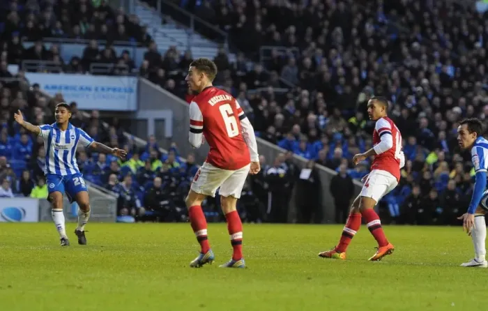 Framed Print : Theo Walcott's Deflected Goal: Arsenal Cruise Past Brighton in FA Cup Framed Print : Theo Walcott's Deflected Goal: Arsenal Cruise Past Brighton in FA Cup