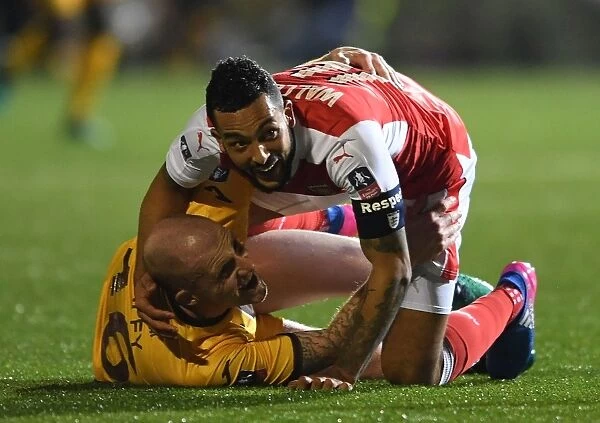 Theo Walcott's Dramatic Fall: Sutton United vs. Arsenal in The Emirates FA Cup