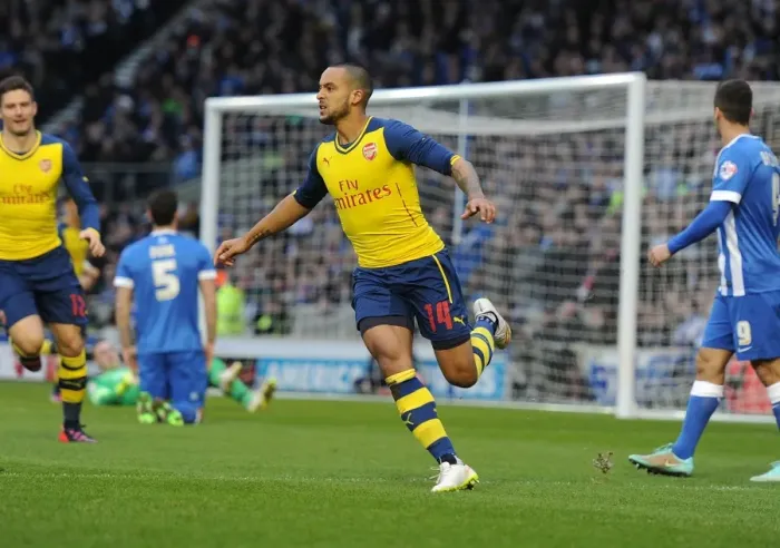Framed Print : Theo Walcott's FA Cup Stunner: Arsenal's Euphoric Celebration at Brighton & Hove Albion