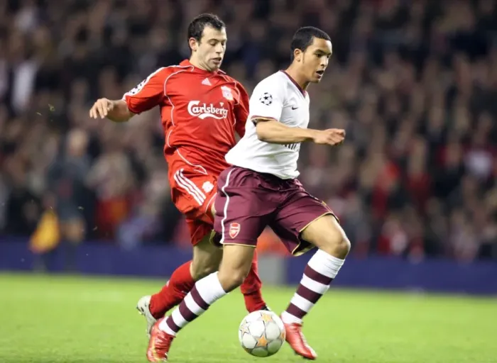 Framed Print : Theo Walcott's Game-Changer: Outmaneuvering Mascherano to Set Up Adebayor's Goal in Arsenal's UEFA Champions League Showdown at Anfield, 2008 Framed Print : Theo Walcott's Game-Changer: Outmaneuvering Mascherano to Set Up Adebayor's Goal in Arsenal's UEFA Champions League Showdown at Anfield, 2008