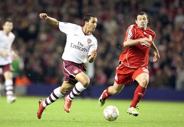 Theo Walcott's Game-Changing Moment: Beating Mascherano to Set Up Adebayor's Goal in Arsenal's UEFA Champions League Battle at Anfield