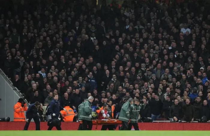 Framed Print : Theo Walcott's Injury Marred by Abuse from Tottenham Fans during Arsenal v Tottenham FA Cup Match